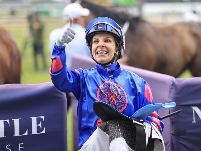 NEWCASTLE, AUSTRALIA - NOVEMBER 13: Jenny Duggan on Torrens waves to her family in the stand as she returns to scale after winning race 6 the Visit Karaka 2022 âThe Beaufordâ during Sydney Racing at Newcastle Racecourse on November 13, 2021 in Newcastle, Australia. (Photo by Mark Evans/Getty Images)