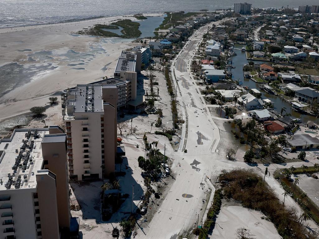 Beach sand covers a road at Fort Myers. Picture: Joe Raedle/Getty Images/AFP