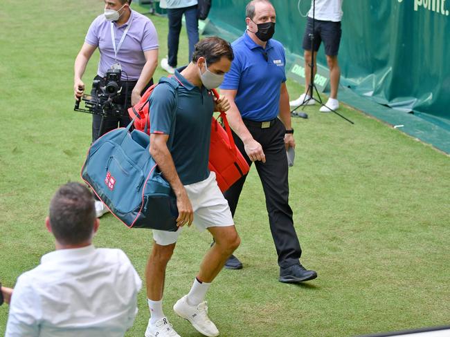 HALLE, GERMANY - JUNE 16: Roger Federer of Switzerland leaves the Center Court after losing his match against Felix Auger-Aliassime of Canada during day 5 of the Noventi Open at OWL-Arena on June 16, 2021 in Halle, Germany. (Photo by Thomas F. Starke/Getty Images)