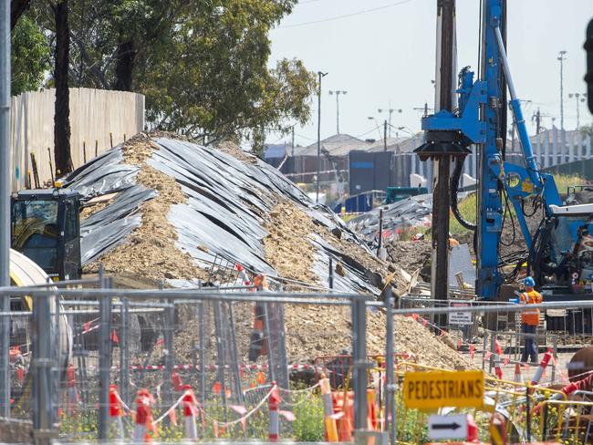 A mound of soil- covered in black tarp behind the barricades running along the Westgate Freeway, Williamstown Road on- ramp heading outbound.Picture Jay Town