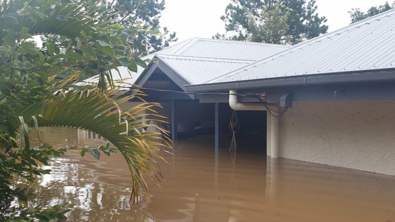 “The house is going under”: Jasmine Whiting witnessed her mother’s home swallowed whole by flood waters, which slowly crept towards the roof on Friday morning.