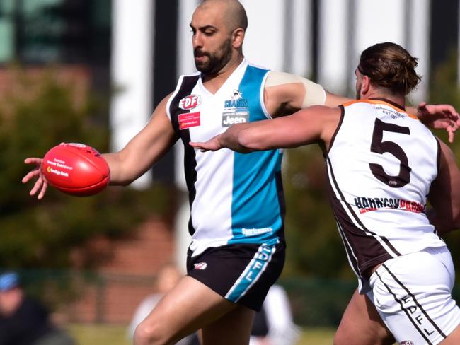 Raaf Rachrache gets a kick away for Hillside in the EDFL. Picture: Jamie Morey