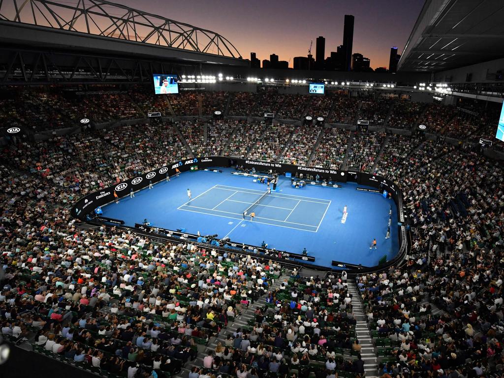 TOPSHOT - Spectators watch the men's singles quarter-finals match between Spain's Rafael Nadal and Croatia's Marin Cilic on day nine of the Australian Open tennis tournament in Melbourne on January 23, 2018. / AFP PHOTO / SAEED KHAN / -- IMAGE RESTRICTED TO EDITORIAL USE - STRICTLY NO COMMERCIAL USE --