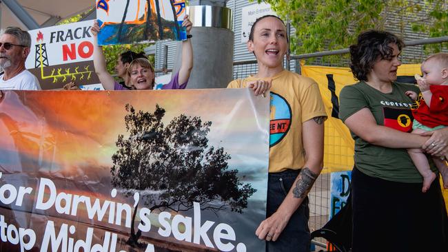 Greens MLA Kat MacNamara (yellow shirt) protesting outside the NT Resources Week 2024 conference in Darwin. Picture: Pema Tamang Pakhrin