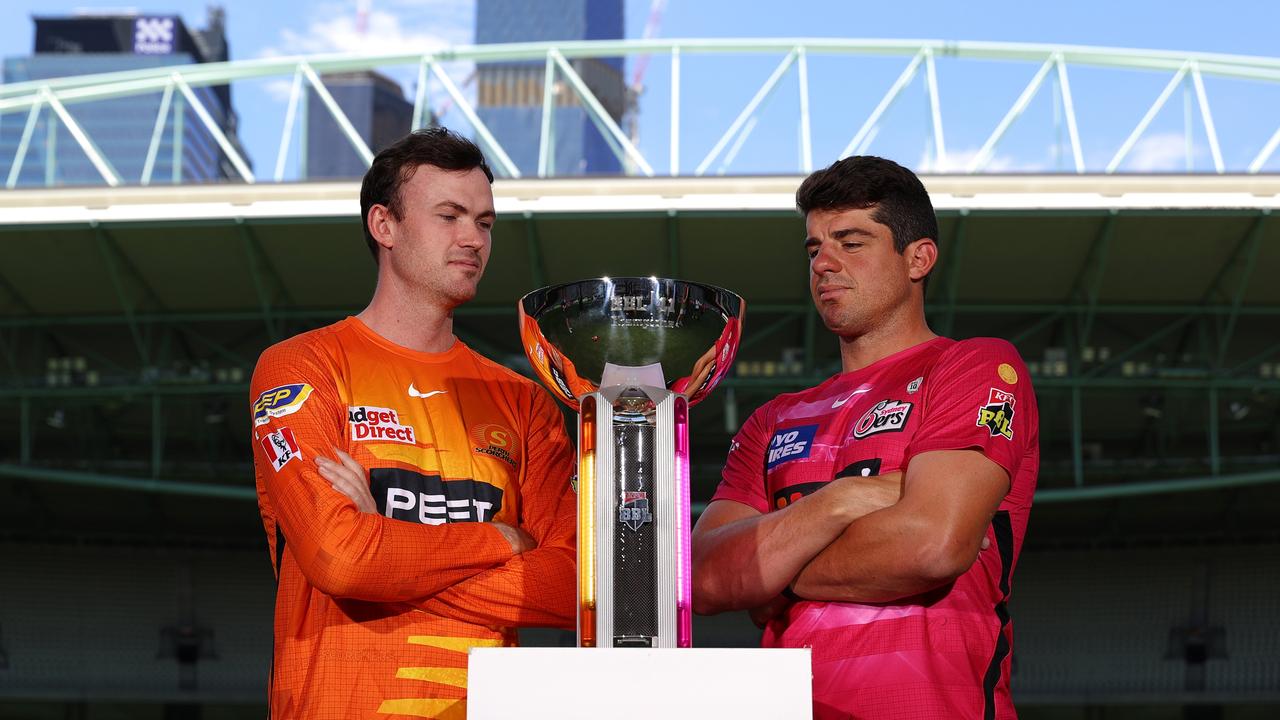 Perth Scorchers captain Ashton Turner and Sydney Sixers captain Moises Henriques with the BBL trophy ahead of their final at Marvel Stadium on January 27, 2022. Photo: Getty Images