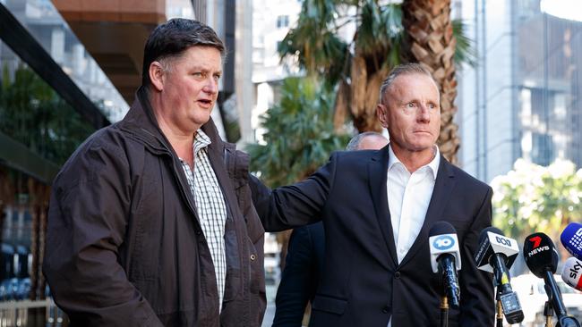 Matt Mullen and Adam Bray, fathers of Hunter Valley bus crash victims Bec Mullen and Zach Bray, speak to reporters after meeting with Attorney-General Michael Daley in Sydney. Picture: Max Mason-Hubers