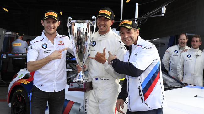 Chaz Mostert (C) and teammates Marco Wittmann (L) and Augusto Farfus celebrate pole position. Pic: Mark Horsburgh.