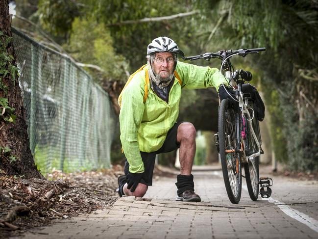 The Mike Turtur Bikeway, Wayville is in a state of disrepair Ð but neither the local council nor the government will take responsibility, Sunday July 15, 2018 cyclist Bob Fleming (0433 358 793) at a point where the pavers are lifting due to tree roots - pic AAP/MIKE BURTON