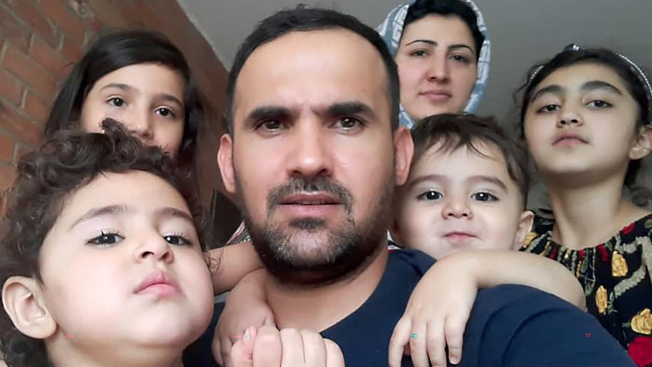 Ehsan Saadat, a 33-year-old Afghan, who recently arrived in Canada, posing with his wife and his children in Toronto. Picture: FAMILY HANDOUT / AFP.
