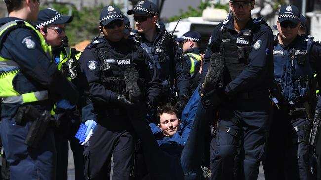 Most protesters were carried away by police. Picture: James Ross/AAP.