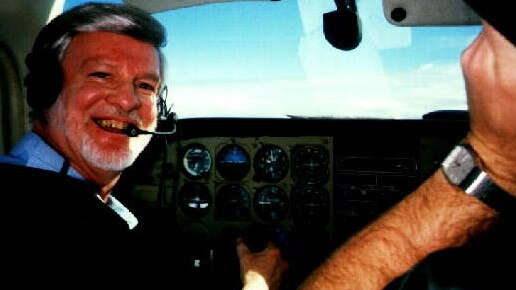 Les Nixon, 82, behind the controls of his plane.