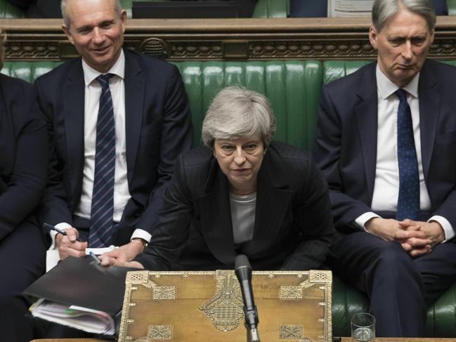 In this image made available by UK Parliament, Britain's Prime Minister Theresa May speaks during Prime Minister's Questions in the House of Commons, London, Wednesday, May 22, 2019. British Prime Minister Theresa May dug in Wednesday against a growing push by both rivals and former allies to remove her from office as her attempts to lead Britain out of the European Union appeared to be headed for a dead end. (Mark Duffy/UK Parliament via AP)