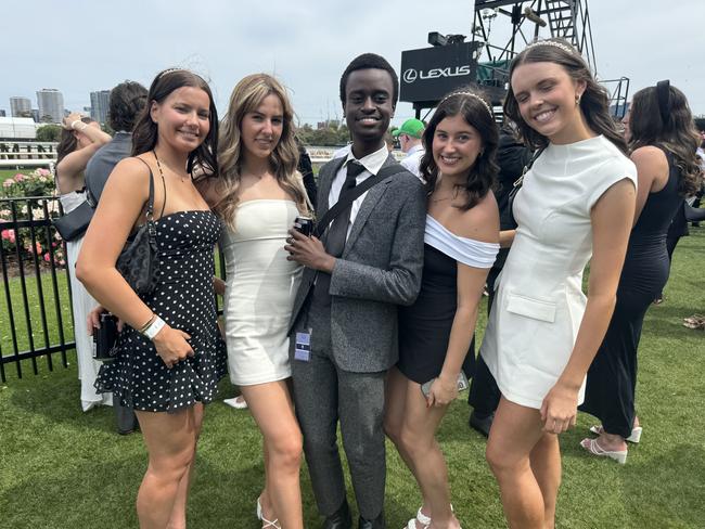 Chelsea Little, Lexie Hargreaves, Chege Mouthi, Ellyana Batty and Holly Buxton at Flemington for Derby Day on November 2, 2024. Picture: Phillippa Butt