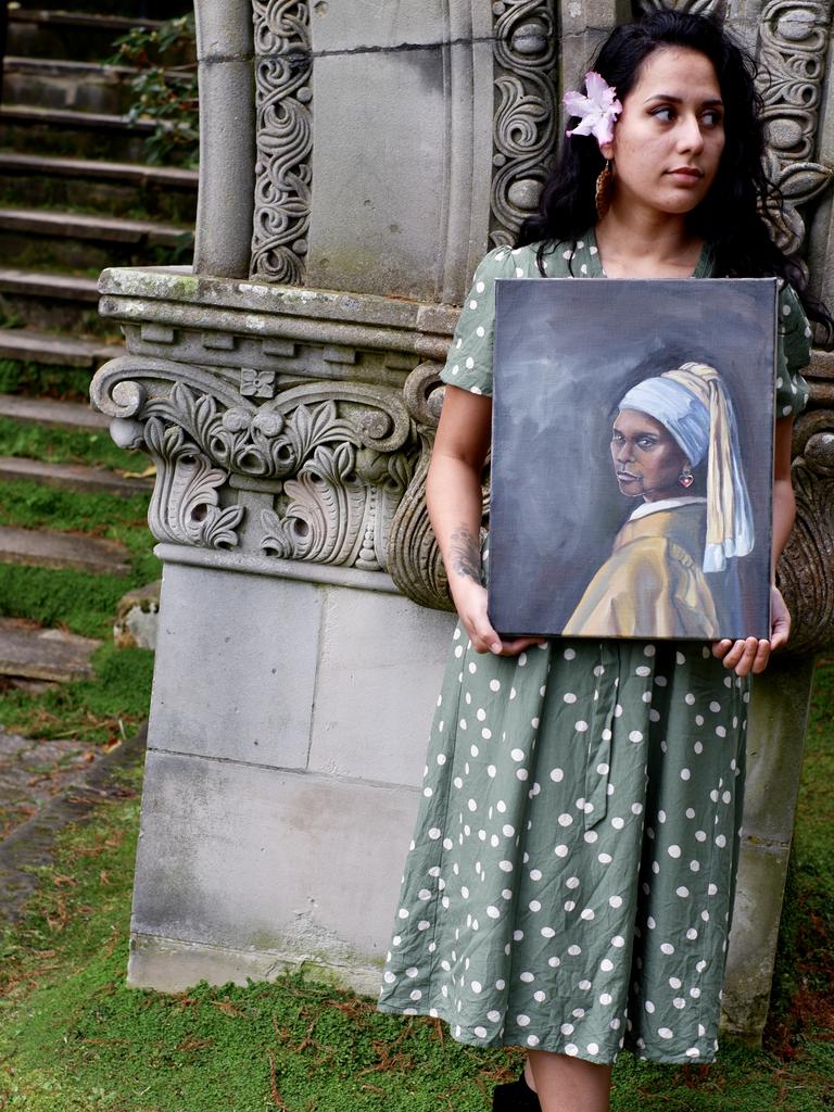 Salmon with her Aunty With A Blak Earring painting, putting an Aboriginal twist on Vermeer’s famous Girl With A Pearl Earring. Picture: Supplied