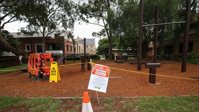 An information notice is seen on outdoor gym equipment at North Sydney after public gatherings were limited to two people.