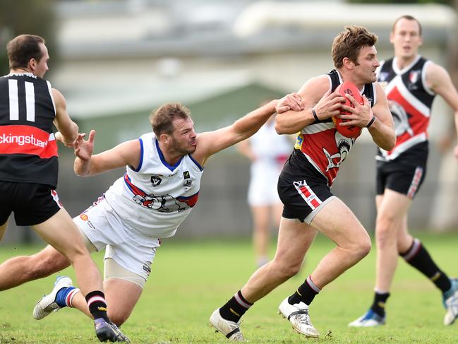 Peninsula Football League: Bonbeach v Mornington at Bonbeach Reserve. Bonbeach #3 Gary Carpenter bursts through a tackle.  Picture: Chris Eastman