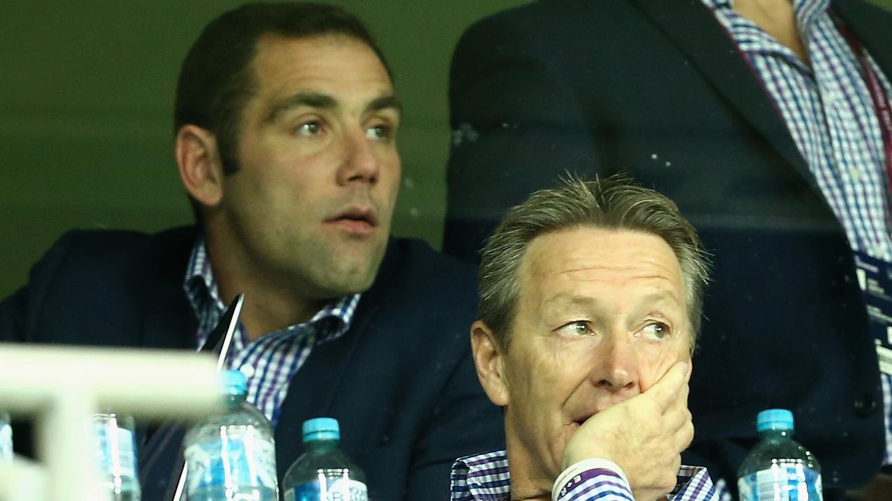 Craig Bellamy coach of the Melbourne Storm looks on along with Cameron Smith