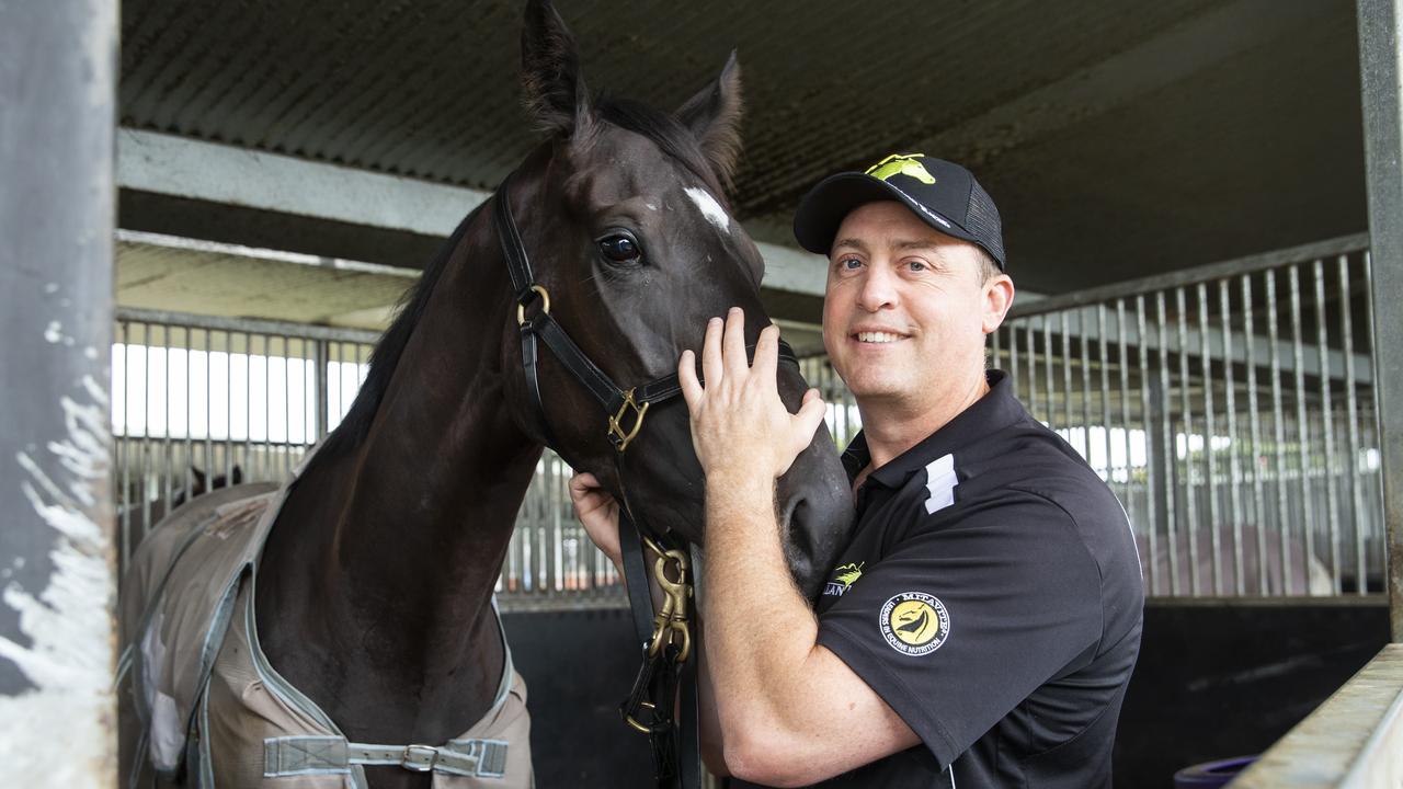 Trainer Tony Gollan with his Queensland Oaks runner Good Soize in the stables at Eagle Farm. Picture: Lachie Millard