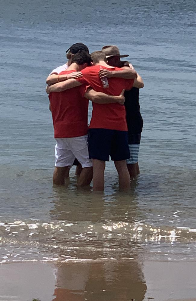 Loved ones remember Angus Murray at one of his favourite spots on the Fraser Coast.