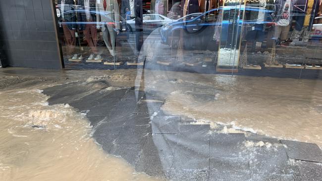 flooding in Murray Street outside Routleys in Hobart's CBD