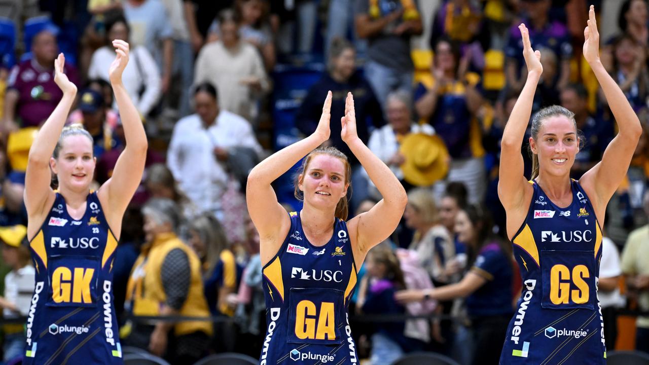 SUNSHINE COAST, AUSTRALIA – APRIL 16: Stephanie Wood, Maddie Hinchliffe and Cara Koenen of the Lightning celebrate victory after the round five Super Netball match between Sunshine Coast Lightning and Melbourne Vixens at University of Sunshine Coast, on April 16, 2022, in Sunshine Coast, Australia. (Photo by Bradley Kanaris/Getty Images)