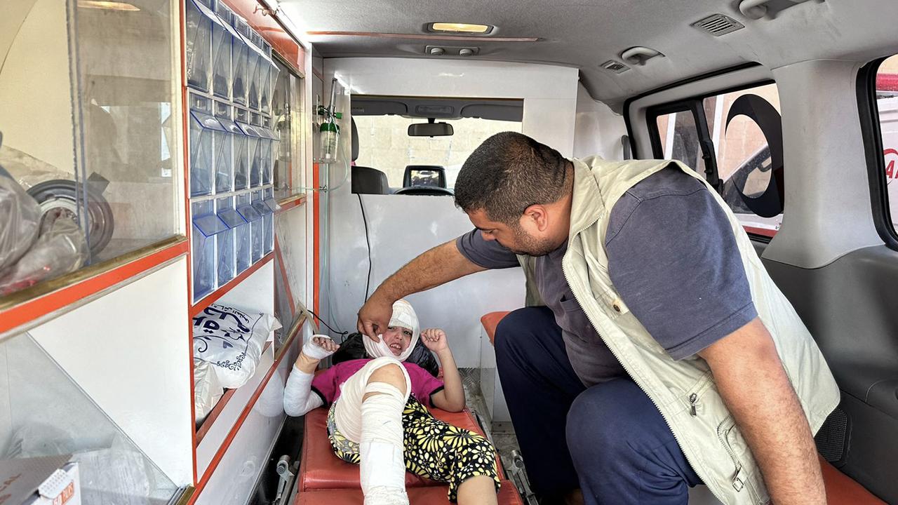 An injured Palestinian child lies in an ambulance. Picture: AFP