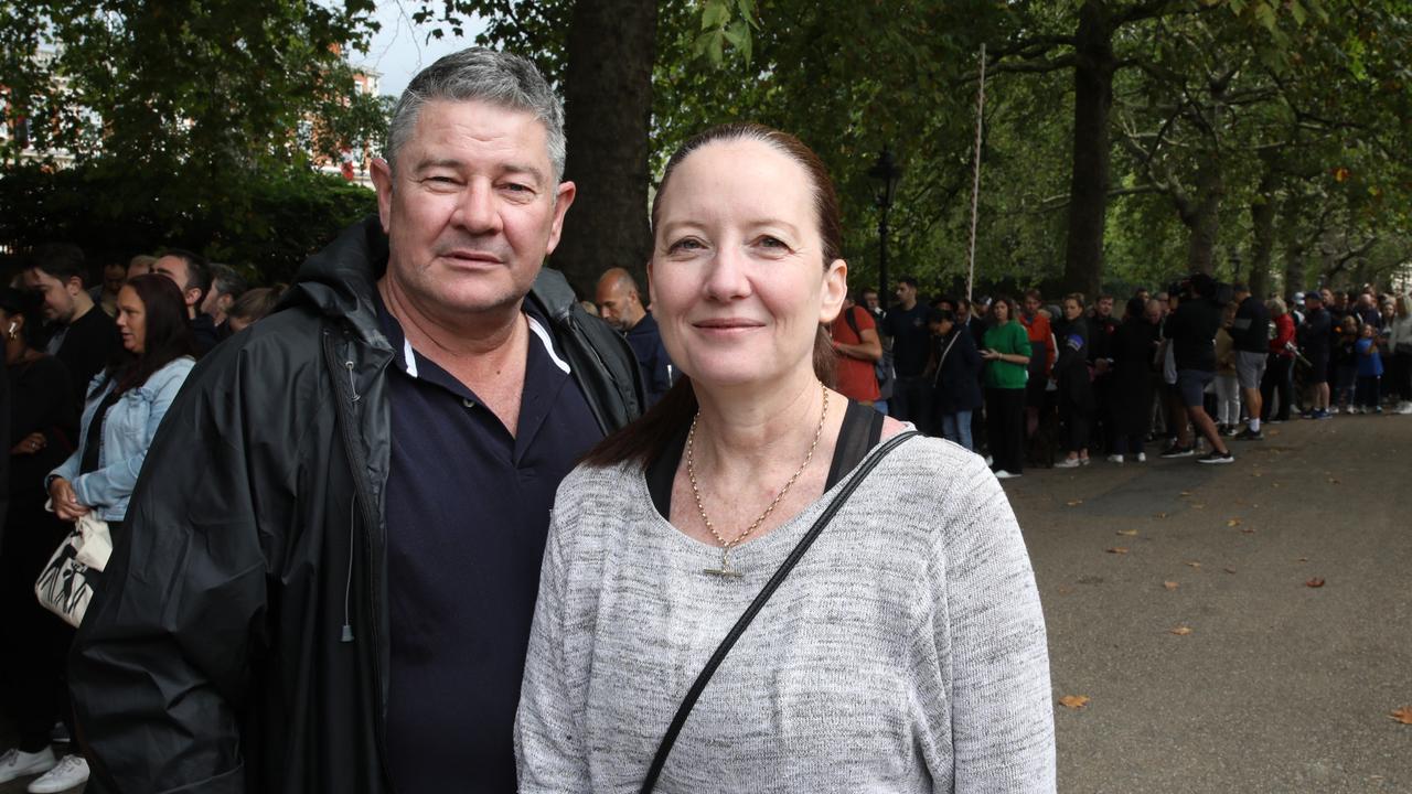 Kristy and Mark Longford wait to get in St James Palace for the King proclamation. Picture: Ella Pellegrini