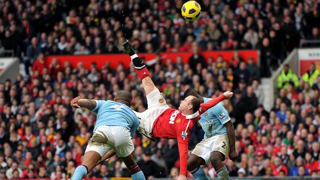 FILE - A Saturday, Feb. 12, 2011 photo from files showing Manchester United's Wayne Rooney, centre, scoring his sides second ...