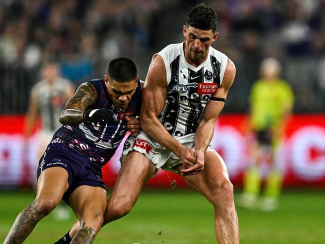 PERTH, AUSTRALIA - MAY 24: Scott Pendlebury of the Magpies competes for the ball with Michael Walters of the Dockers during the 2024 AFL Round 11 match between Walyalup (Fremantle) and the Collingwood Magpies at Optus Stadium on May 24, 2024 in Perth, Australia. (Photo by Daniel Carson/AFL Photos via Getty Images)