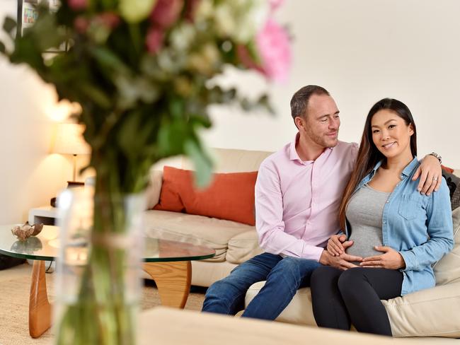 MANLY DAILY/AAP. Young couple Satomi Goto & Xavier Le Baron pose during a photo shoot in their apartment at Manly on Tuesday, June 4. Young couple expecting their first baby have been looking for a home for two years, but found one in Dee Why recently. AAP IMAGE / Troy Snook)