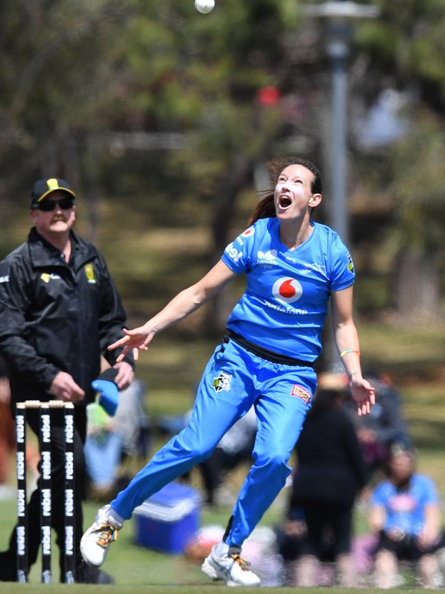 Megan Schutt of the Adelaide Strikers takes a spectacular catch off her own bowling to notch up 50 WBBL wickets for the Strikers. Picture: AAP IMAGE/DAVID MARIUZ