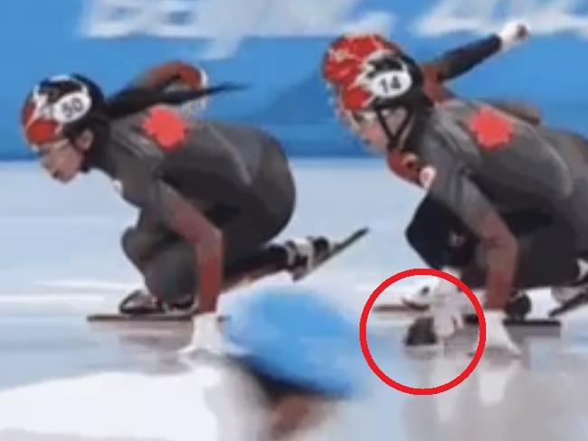 Chinese speed skater Kexin Fan appears to flick a marker towards Canadian Alyson Charles, causing her to fall during the Women's 500m Short Track Speed Skating quarter finals at Capital Indoor Stadium in Beijing, China during the 2022 Winter Olympics.