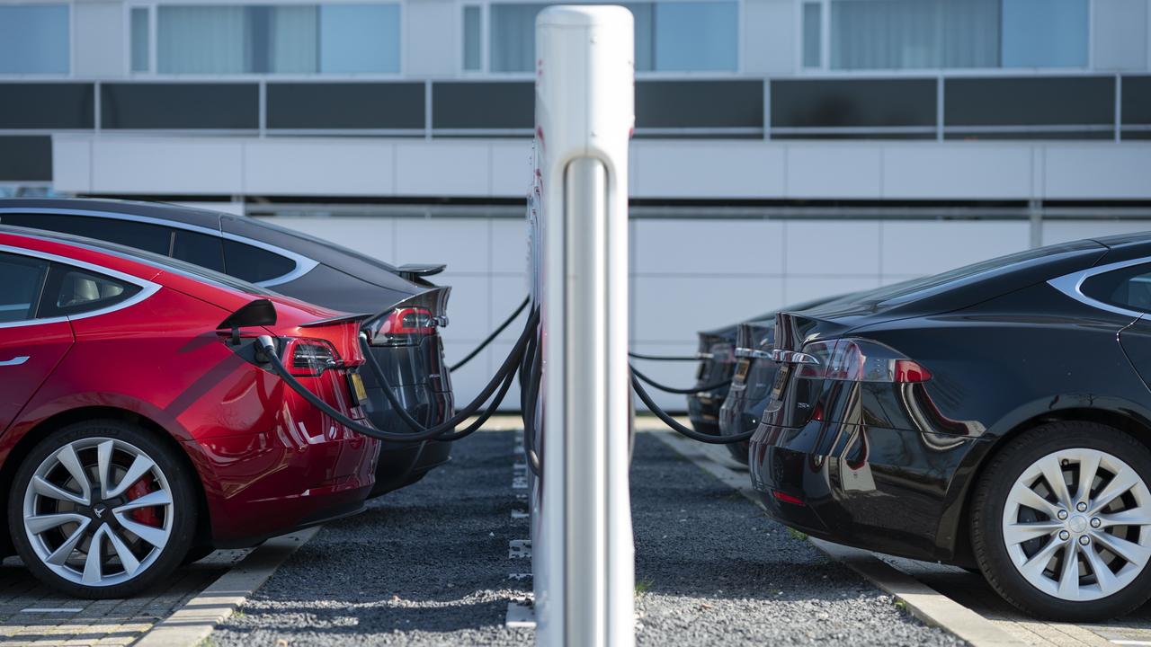 Tesla cars sit charging at a Tesla Supercharger station. Picture: Jasper Juinen/Bloomberg