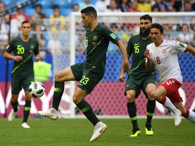 Tom Rogic comes under pressure from Denmark's Thomas Delaney. Pic: AAP