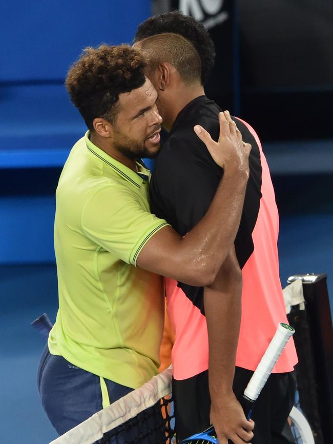 Nick Kyrgios embraces Jo-Wilfried Tsonga after the match. Picture: AFP/Peter Parks