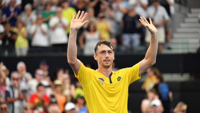 John Millman of Australia celebrates winning his match against Felix Auger-Aliassime of Canada during day 3 of the ATP Cup tennis tournament at Pat Rafter Arena in Brisbane, Sunday, January 5, 2020. (AAP Image/Darren England) NO ARCHIVING, EDITORIAL USE ONLY