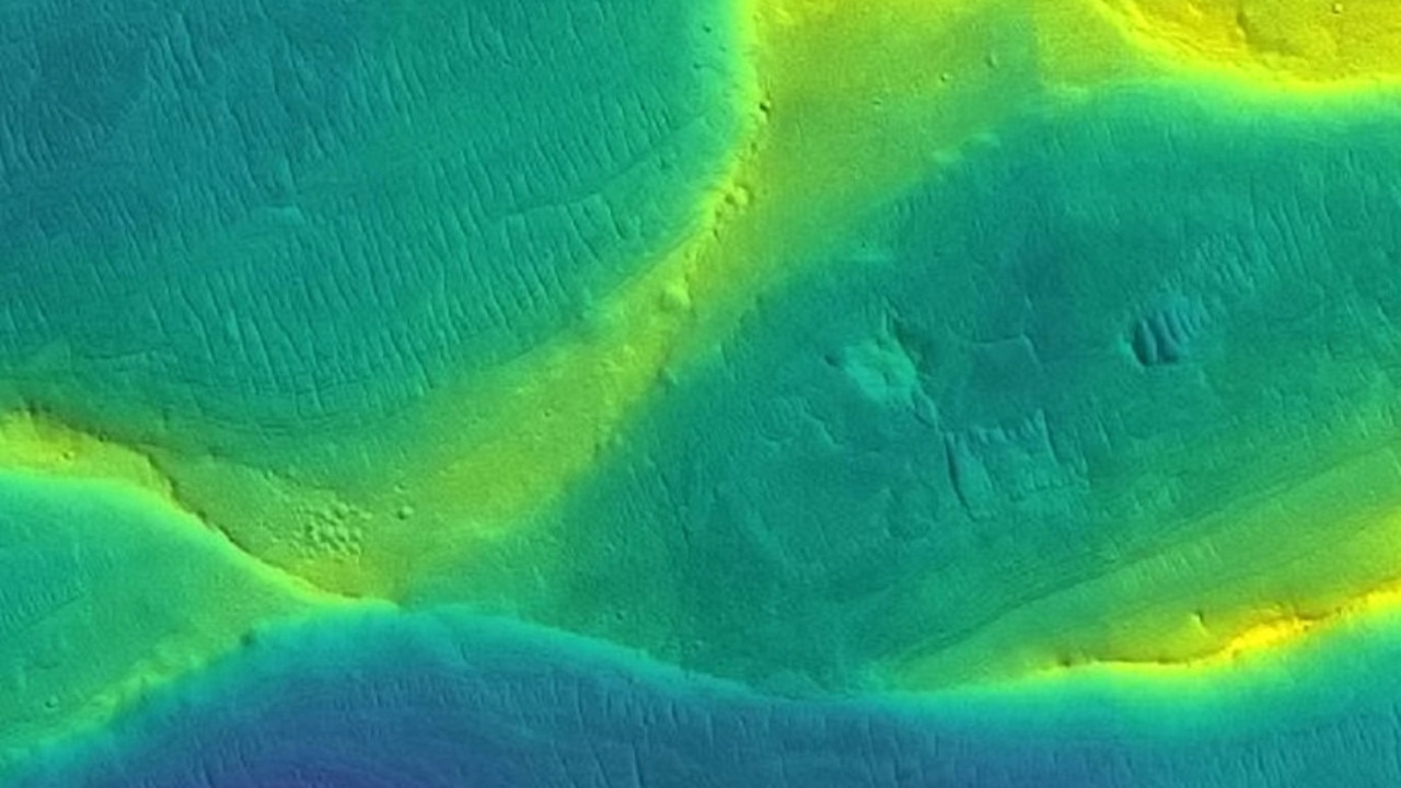 A preserved ancient river channel on Mars, taken by an orbiting satellite, with colour overlaid to show different elevations (blue is low, yellow is high). 