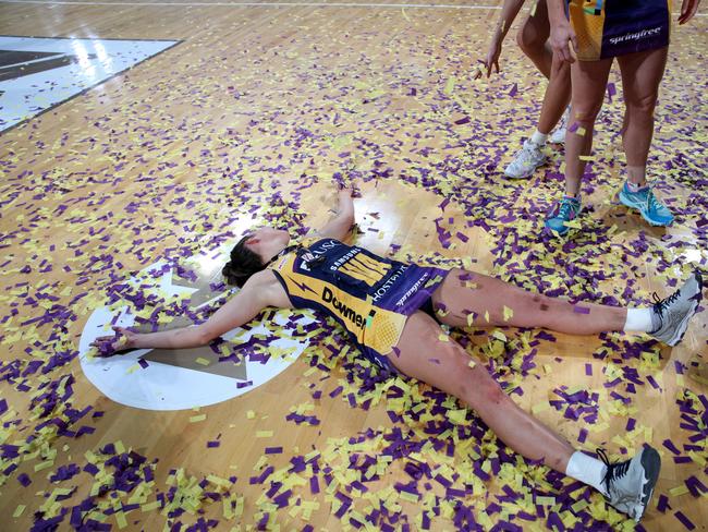 Kelsey Browne takes a swim in the championship confetti. Picture: AAP