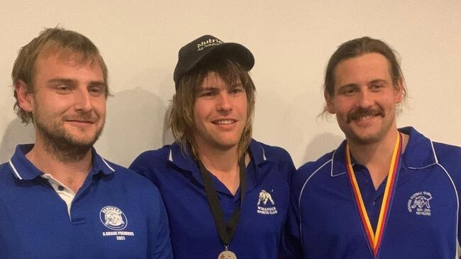 Wisanger's Liam Sampson with Sam Clifford and Dusty Cross. Picture: Kangaroo Island Football Club