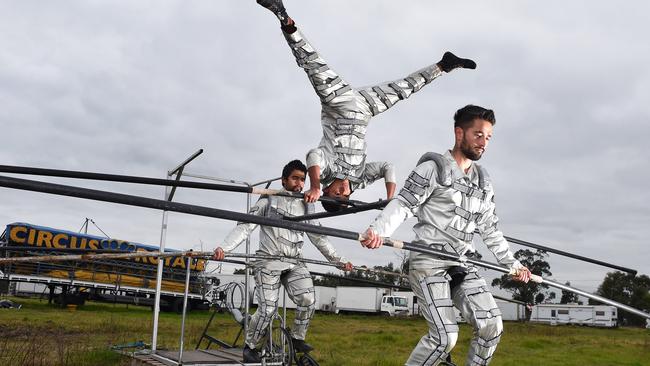 High wire performers Samir Leon, Saret Leon and Sarius Leon have kept training despite being grounded on site. Picture: Josie Hayden