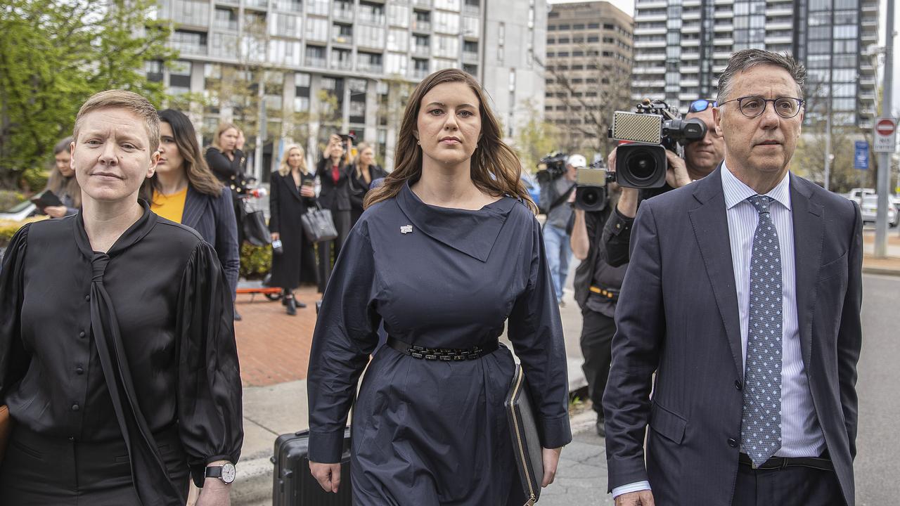 Brittany Higgins arrives at court flanked by her lawyer Leon Zwier (right) and Victims of Crime Commissioner Heidi Yates (left). Picture: Gary Ramage/NCA NewsWire