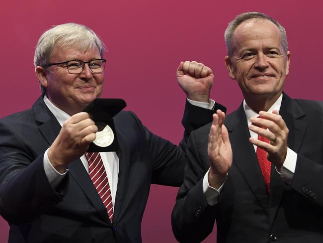 Former Australian prime minister Kevin Rudd (left) is congratulated by Australian Opposition Leader Bill Shorten after receiving the Labor Life Membership during day three of the Labor Party National Conference in Adelaide, Tuesday, December 18, 2018. Labor's 48th National Conference is being held from Sunday 16 to Tuesday 18 December 2018 at the Adelaide Convention Centre. (AAP Image/Lukas Coch) NO ARCHIVING