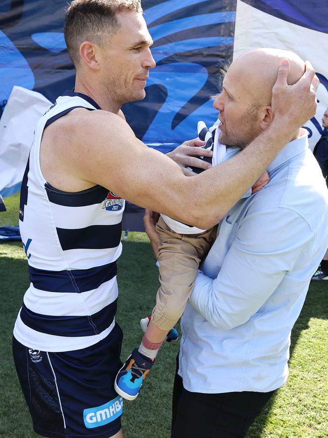 Geelong skipper Joel Selwood hugged Gary Ablett Jnr after carrying his son Levi onto the MCG. Picture: Michael Klein