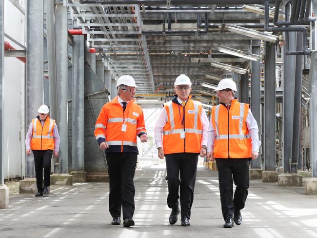 (L-R) Ixom CEO Dean Draper, Prime Minister Malcolm Turnbull and Australian Minister for Energy and the Environment Josh Frydenberg during a tour of the Ixom Plant in Laverton North, Melbourne, Friday, October 20, 2017. (AAP Image/David Crosling) NO ARCHIVING