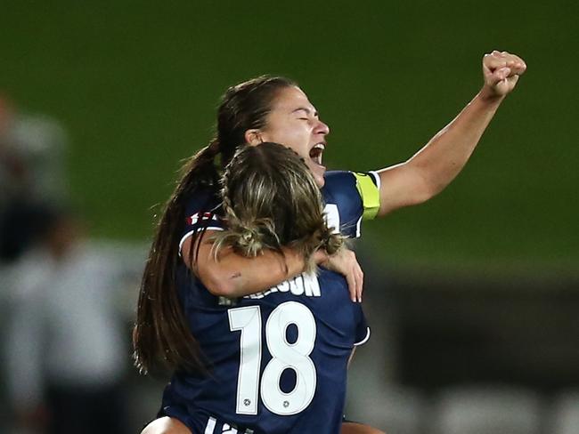 SYDNEY, AUSTRALIA - APRIL 11: Angela Beard of the Victory and Kayla Morrison of the Victory celebrate after victory during the 2021 W-League Grand Final match between Sydney FC and Melbourne Victory at Netstrata Jubilee Stadium on April 11, 2021 in Sydney, Australia. (Photo by Jason McCawley/Getty Images)