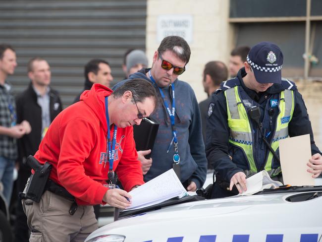 Detectives at the scene. Picture: Sarah Matray