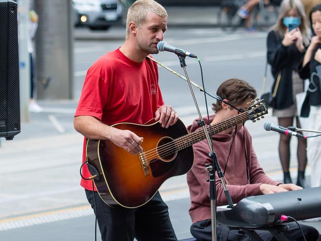 Australian band The Rubens play a set in Collins Street Mall for a City of Melbourne initiative to get people back to the city. A red heart made from red roses was played as a tribute to Michael Gudinski, The Cubans was one of his favourite Australian rock bands. Picture: Jason Edwards