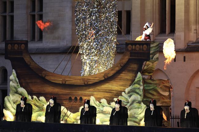 PARIS, FRANCE - JULY 26: Opera Singer Marina Viotti, the Orchestre de Paris and a Choir perform during the athletesÃ¢â&#130;¬â&#132;¢ parade on the River Seine near the Supreme Court during the opening ceremony of the Olympic Games Paris 2024 on July 26, 2024 in Paris, France. (Photo by Buda Mendes/Getty Images)