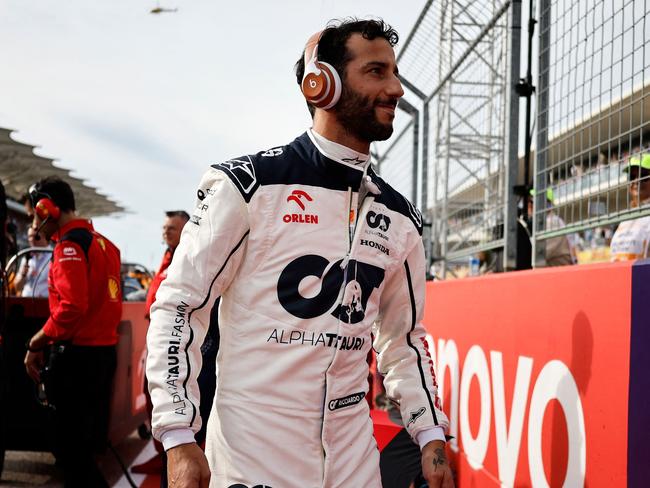 AUSTIN, TEXAS - OCTOBER 21: Daniel Ricciardo of Australia and Scuderia AlphaTauri prepares to drive on the grid prior to the Sprint ahead of the F1 Grand Prix of United States at Circuit of The Americas on October 21, 2023 in Austin, Texas.   Chris Graythen/Getty Images/AFP (Photo by Chris Graythen / GETTY IMAGES NORTH AMERICA / Getty Images via AFP)