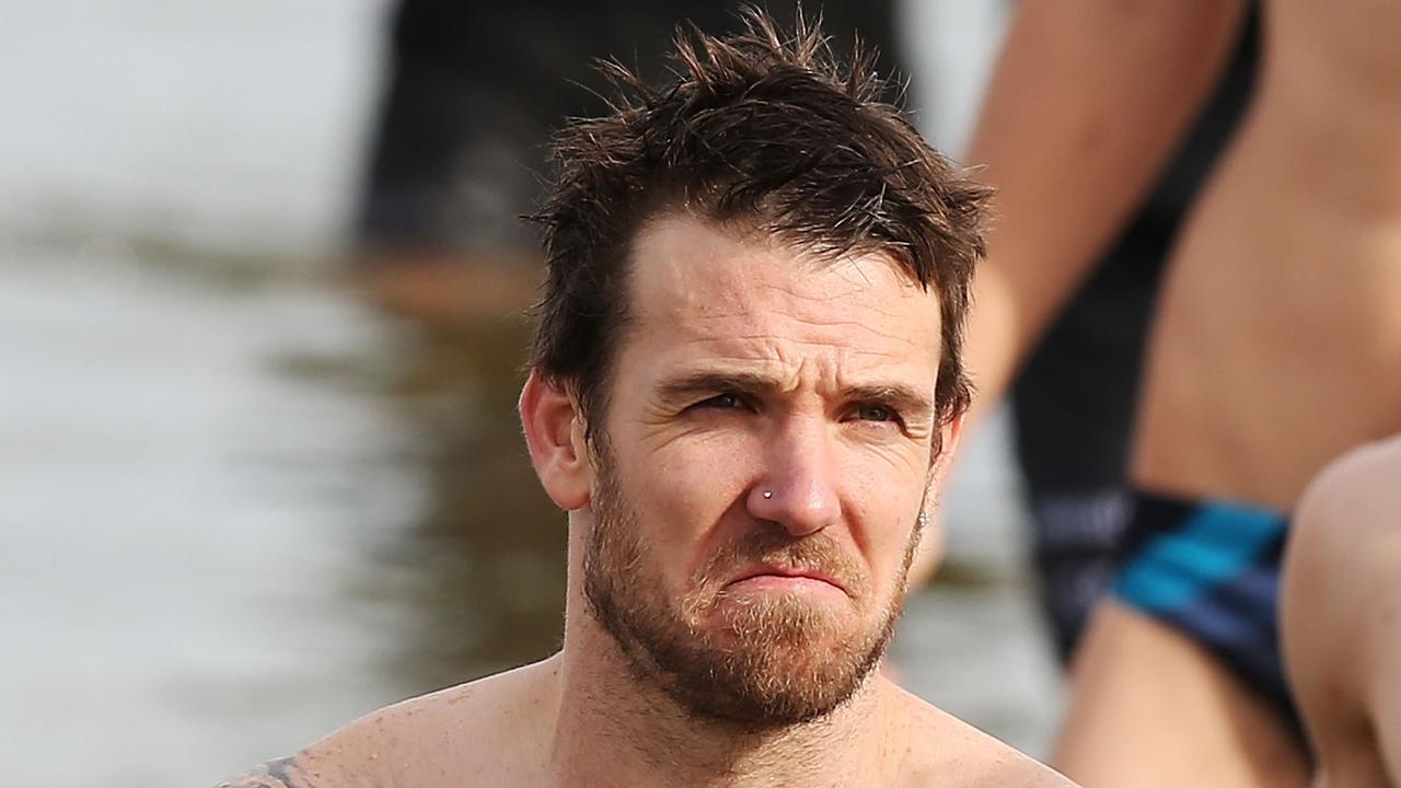 MELBOURNE, AUSTRALIA — JULY 14: Dane Swan of the Magpies reacts as he walks out of the water during a Collingwood Magpies AFL recovery session at St Kilda Beach on July 14, 2014 in Melbourne, Australia. (Photo by Michael Dodge/Getty Images)